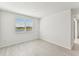 Spacious bedroom with window, carpet, and neutral walls at 13868 Richland Gulf Cir, Parrish, FL 34219