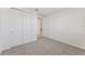 Bright bedroom with carpet and double doors to bathroom at 13868 Richland Gulf Cir, Parrish, FL 34219