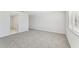 Bright bedroom with carpet flooring and a window at 13868 Richland Gulf Cir, Parrish, FL 34219