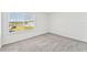 Cozy bedroom with a window overlooking a lake at 13868 Richland Gulf Cir, Parrish, FL 34219