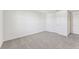 Well-lit bedroom featuring neutral carpeting at 13868 Richland Gulf Cir, Parrish, FL 34219