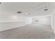 Bright and airy bonus room with grey carpet and multiple windows at 13868 Richland Gulf Cir, Parrish, FL 34219