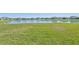 Aerial view of a community with lake and homes at 13868 Richland Gulf Cir, Parrish, FL 34219