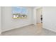 Simple dining room with tile flooring and kitchen access at 13868 Richland Gulf Cir, Parrish, FL 34219