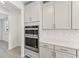 Modern kitchen with double oven and custom cabinetry at 13868 Richland Gulf Cir, Parrish, FL 34219