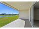 Covered patio overlooking a serene lake at 13868 Richland Gulf Cir, Parrish, FL 34219