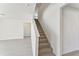 Modern staircase with carpeted steps and light walls at 13868 Richland Gulf Cir, Parrish, FL 34219