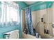 Bathroom with shower/tub combo and blue walls at 1450 Ward St, North Port, FL 34288