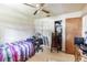 Simple bedroom with a double bed, desk, and closet at 1450 Ward St, North Port, FL 34288