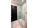 Clean bathroom with a walk-in shower and marble flooring at 7801 9Th S Ave, St Petersburg, FL 33707