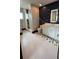 Stylish bathroom with hexagonal tile floor and walk-in shower at 7801 9Th S Ave, St Petersburg, FL 33707
