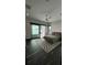 Bright bedroom with water views and private balcony access at 7801 9Th S Ave, St Petersburg, FL 33707