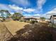 Large backyard with fenced area and partial view of home at 12010 Villa Rd, Spring Hill, FL 34609
