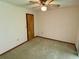 Spacious bedroom with carpeted floor and ceiling fan at 12010 Villa Rd, Spring Hill, FL 34609