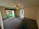 Spacious bedroom with carpet flooring and access to a bathroom and pool at 12010 Villa Rd, Spring Hill, FL 34609