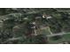 Aerial view showing a single-story house with a pool in a residential neighborhood at 4935 Mockingbird Dr, Dade City, FL 33523