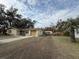 Ranch-style home with a spacious yard at 4935 Mockingbird Dr, Dade City, FL 33523