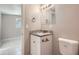 Small bathroom with granite vanity and toilet at 634 Newton S Ave, St Petersburg, FL 33701