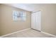 Bedroom with tile floors, window, and double door closet at 634 Newton S Ave, St Petersburg, FL 33701