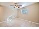 Bright bedroom with tile floors and ceiling fan at 634 Newton S Ave, St Petersburg, FL 33701