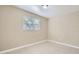 Simple bedroom with tile floors and window coverings at 634 Newton S Ave, St Petersburg, FL 33701