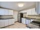 Renovated kitchen featuring white cabinets and granite countertops at 634 Newton S Ave, St Petersburg, FL 33701