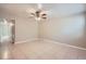 Spacious living room with tile floors and ceiling fan at 634 Newton S Ave, St Petersburg, FL 33701