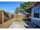 Backyard with wooden fence and small patio area at 4675 20Th S Ave, St Petersburg, FL 33711