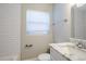 Clean bathroom with white subway tile, marble vanity, and window at 4675 20Th S Ave, St Petersburg, FL 33711