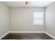 Bright bedroom with dark brown wood-look flooring and window at 4675 20Th S Ave, St Petersburg, FL 33711