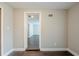 Spacious bedroom with dark brown wood-look flooring and neutral walls at 4675 20Th S Ave, St Petersburg, FL 33711