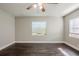 Spacious bedroom with dark hardwood floors and window blinds at 4675 20Th S Ave, St Petersburg, FL 33711