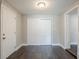 Hallway with dark hardwood floors and doors to rooms at 4675 20Th S Ave, St Petersburg, FL 33711
