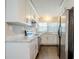 Modern kitchen with white cabinets and marble countertops at 4675 20Th S Ave, St Petersburg, FL 33711