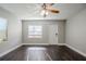 Bright living room with dark hardwood floors and ceiling fan at 4675 20Th S Ave, St Petersburg, FL 33711