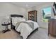 Charming bedroom with a queen-size bed and hardwood floors at 8500 Candlewood Ct, Sarasota, FL 34240