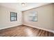 Bright bedroom with wood-look floors and neutral wall colors at 6412 Skyline Ct, Spring Hill, FL 34606