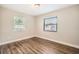 Spacious bedroom with wood-look floors and neutral color scheme at 6412 Skyline Ct, Spring Hill, FL 34606