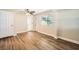 Well-lit bedroom with wood-look flooring and built-in closet at 6412 Skyline Ct, Spring Hill, FL 34606
