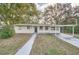 Charming house with a covered carport and well-manicured lawn at 6412 Skyline Ct, Spring Hill, FL 34606