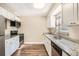 Modern kitchen with granite countertops and updated cabinetry at 6412 Skyline Ct, Spring Hill, FL 34606