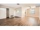 Spacious living room with wood-look flooring and lots of natural light at 6412 Skyline Ct, Spring Hill, FL 34606