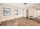 Bright and airy living room with wood-look floors and ample natural light at 6412 Skyline Ct, Spring Hill, FL 34606