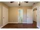 Bedroom with hardwood floors and access to a full bath at 6009 N 39Th St, Tampa, FL 33610
