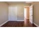 Bright bedroom featuring wood-look floors and ample closet space at 6009 N 39Th St, Tampa, FL 33610