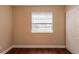 Well-lit bedroom with wood-look floors and a closet at 6009 N 39Th St, Tampa, FL 33610