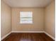 Simple bedroom with wood-look floors and a window at 6009 N 39Th St, Tampa, FL 33610