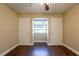 Simple bedroom with hardwood floors and double closets at 6009 N 39Th St, Tampa, FL 33610