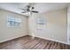 Spacious bedroom with wood-look vinyl flooring and neutral-toned walls at 5405 Mariner Blvd, Spring Hill, FL 34609