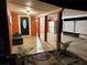 Inviting front porch with covered entryway, storage area, and landscaping at 1203 Saturn, Clearwater, FL 33755